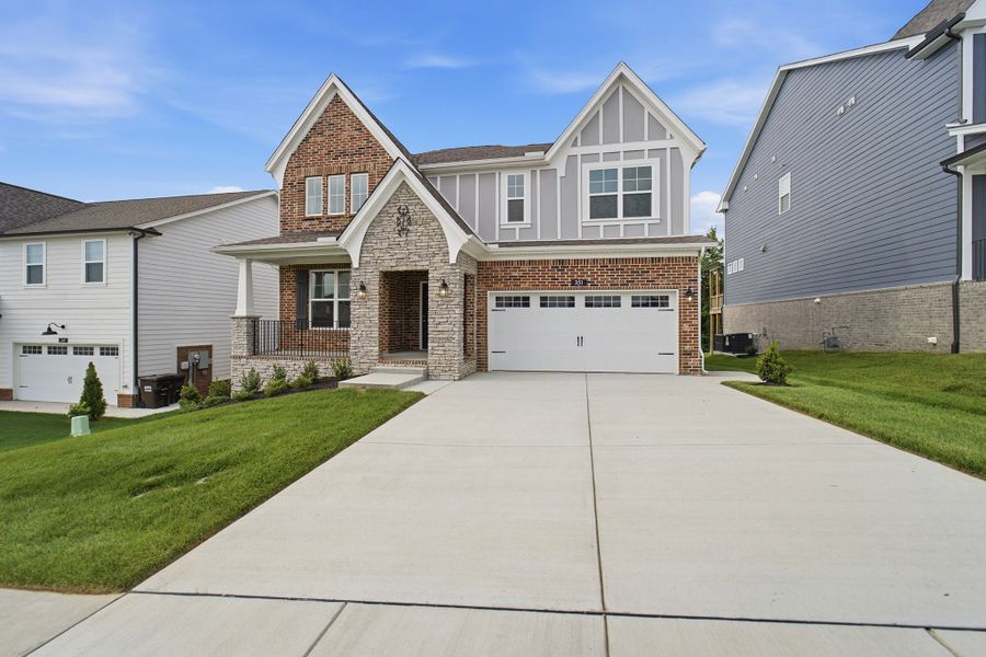 Front exterior of a new home in The Retreat at Norman Farm, Hendersonville, TN, highlighting curb appeal (Image 20).