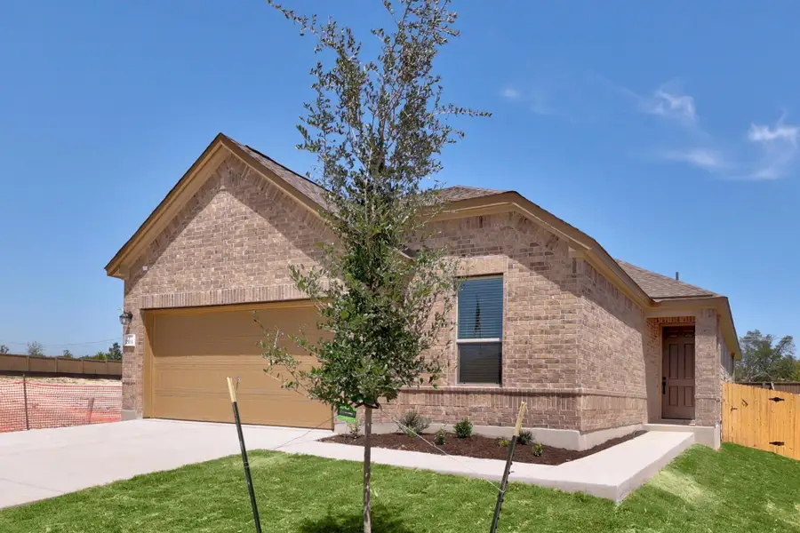 Front exterior of a new home in Overlook Ranch, Georgetown, TX, highlighting curb appeal (Image 20). Front exterior of a new home in Overlook Ranch, Georgetown, TX, highlighting curb appeal (Image 20).