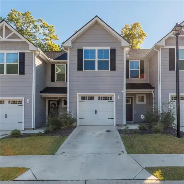 Front exterior of a new home in General Chase, Adairsville, GA, highlighting curb appeal (Image 1). Front exterior of a new home in General Chase, Adairsville, GA, highlighting curb appeal (Image 1).