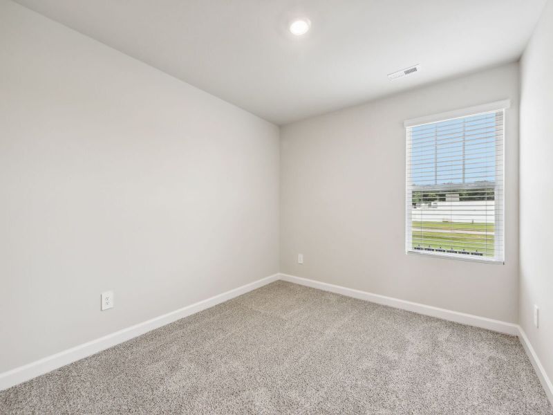 Two secondary bedrooms round out the upstairs.