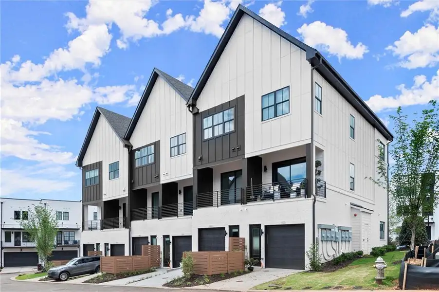 Front exterior of a new home in The Gathering – Alpharetta, Alpharetta, GA, highlighting curb appeal (Image 2). Front exterior of a new home in The Gathering – Alpharetta, Alpharetta, GA, highlighting curb appeal (Image 2).