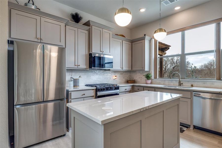 Lots of Cabinet and Counter space.  Quartz Countertops and Natural Light from Kitchen Window