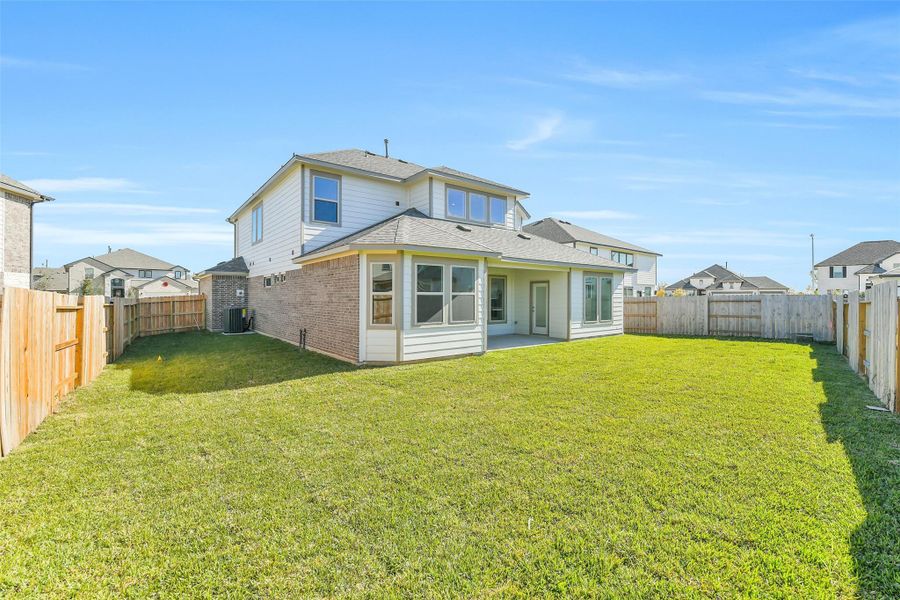 Exterior details and patio area of a home in Stone Creek Ranch, Hockley (Image 23).