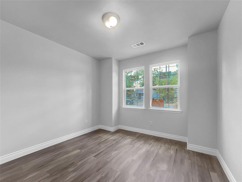 Master Bedroom with dark hardwood / wood-style flooring