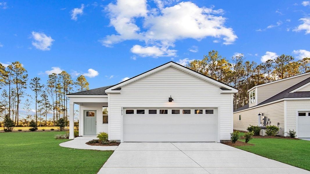 Front exterior of a new home in The Lakes at North Glynn, Brunswick, GA, highlighting curb appeal (Image 1).
