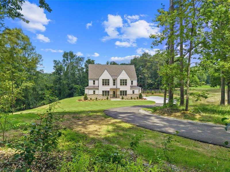 Front exterior of a new home in , Alpharetta, GA, highlighting curb appeal (Image 33). Front exterior of a new home in , Alpharetta, GA, highlighting curb appeal (Image 33).