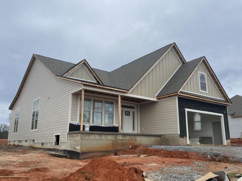 Front exterior of a new home in Tubbs Mountain Estates, Travelers Rest, SC, highlighting curb appeal (Image 15). Front exterior of a new home in Tubbs Mountain Estates, Travelers Rest, SC, highlighting curb appeal (Image 15).