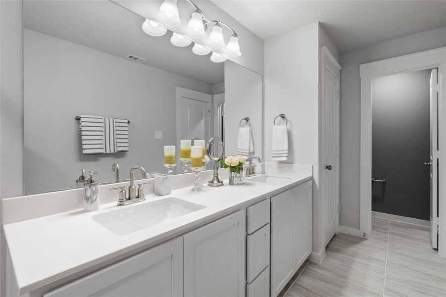 Bathroom with vanity and tile patterned floors