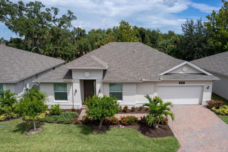 Front exterior of a new home in Bella Rosa, Vero Beach, FL, highlighting curb appeal (Image 20). Front exterior of a new home in Bella Rosa, Vero Beach, FL, highlighting curb appeal (Image 20).