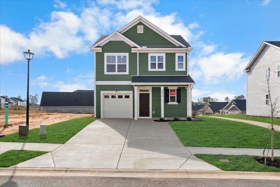 Front exterior of a new home in Windsor, North Augusta, SC, highlighting curb appeal (Image 1). Front exterior of a new home in Windsor, North Augusta, SC, highlighting curb appeal (Image 1).