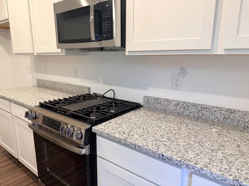 Kitchen - Chic white finishes and smooth surfaces shine. Kitchen - Chic white finishes and smooth surfaces shine.