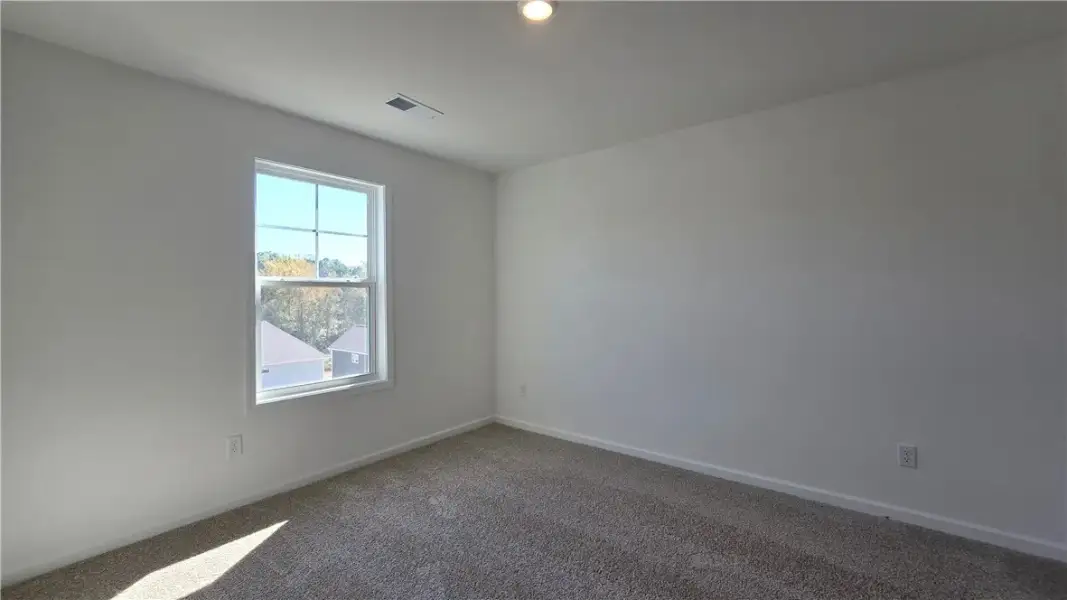 Plush carpeting and a classic multi-lite window de