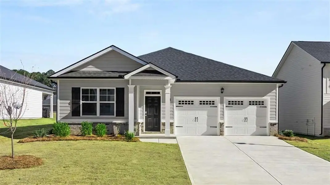 Front exterior of a new home in Oakchase at Hampton, Hampton, GA, highlighting curb appeal (Image 1). Front exterior of a new home in Oakchase at Hampton, Hampton, GA, highlighting curb appeal (Image 1).