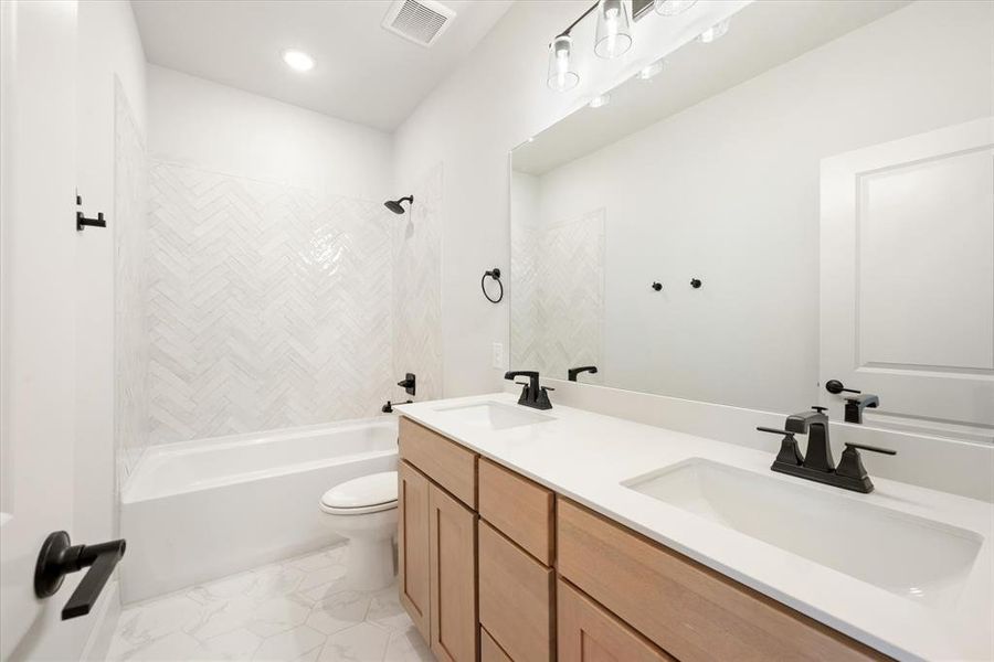 Guests will enjoy their own space in this beautiful guest bath!