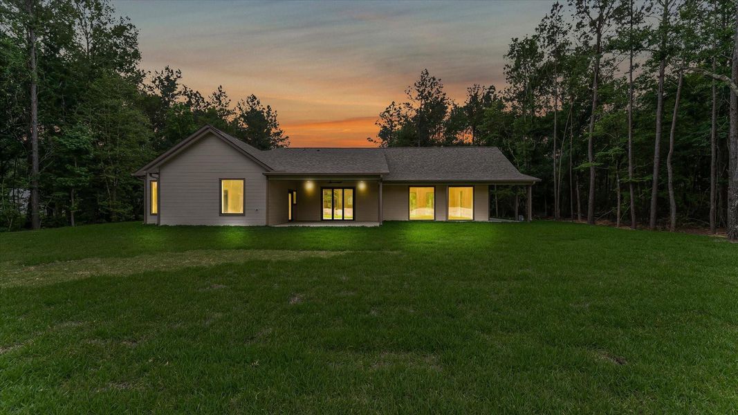 Exterior details and patio area of a home in , Conroe (Image 24).