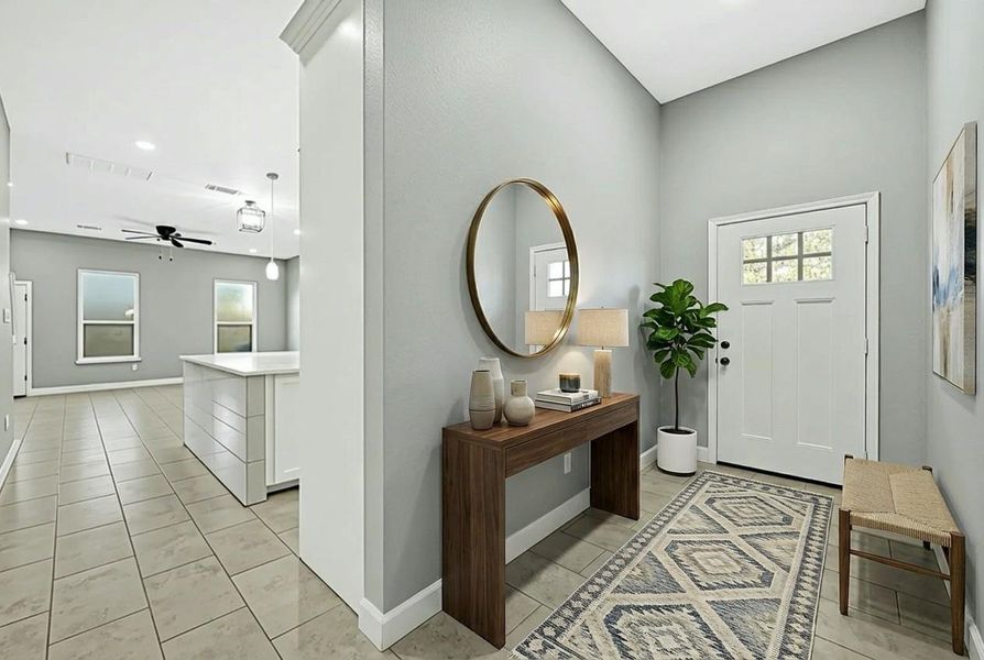 This photo showcases a modern entryway with a light gray palette, featuring a stylish console table with a mirror, decorative items, and a potted plant. The space opens into a bright living area with tiled floors and a ceiling fan, creating a welcoming and contemporary atmosphere.