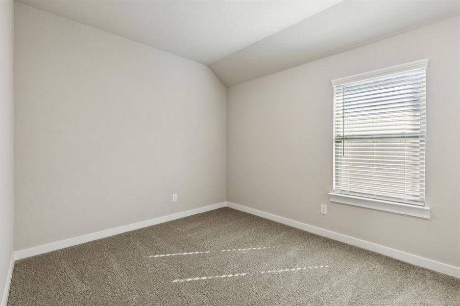 Bedroom in the Emmy II home plan by Trophy Signature Homes - REPRESENTATIVE PHOTO Bedroom in the Emmy II home plan by Trophy Signature Homes - REPRESENTATIVE PHOTO