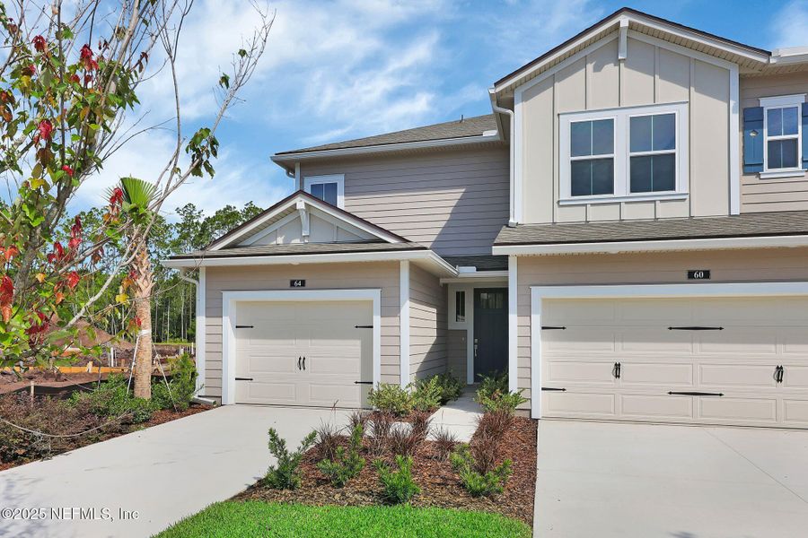 Front exterior of a new home in Woodland Park, Ponte Vedra, FL, highlighting curb appeal (Image 23).