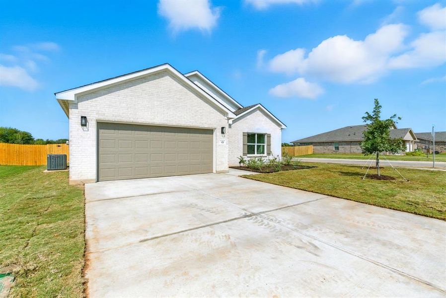 Front exterior of a new home in , Springtown, TX, highlighting curb appeal (Image 20).