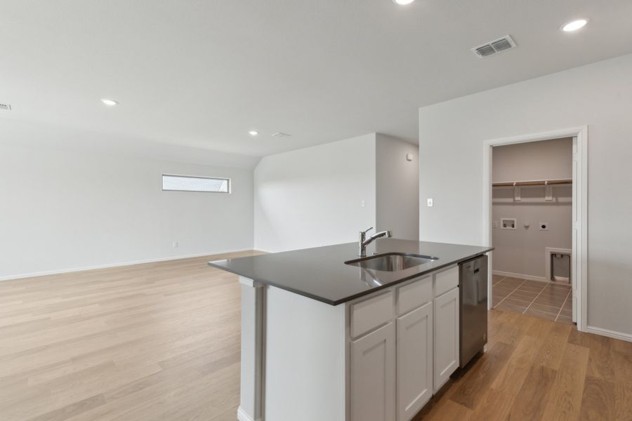 Kitchen in the Hayden home plan by Trophy Signature Homes – REPRESENTATIVE PHOTO