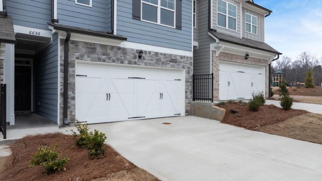 Exterior details and patio area of a home in Waypoint, Flowery Branch (Image 3).