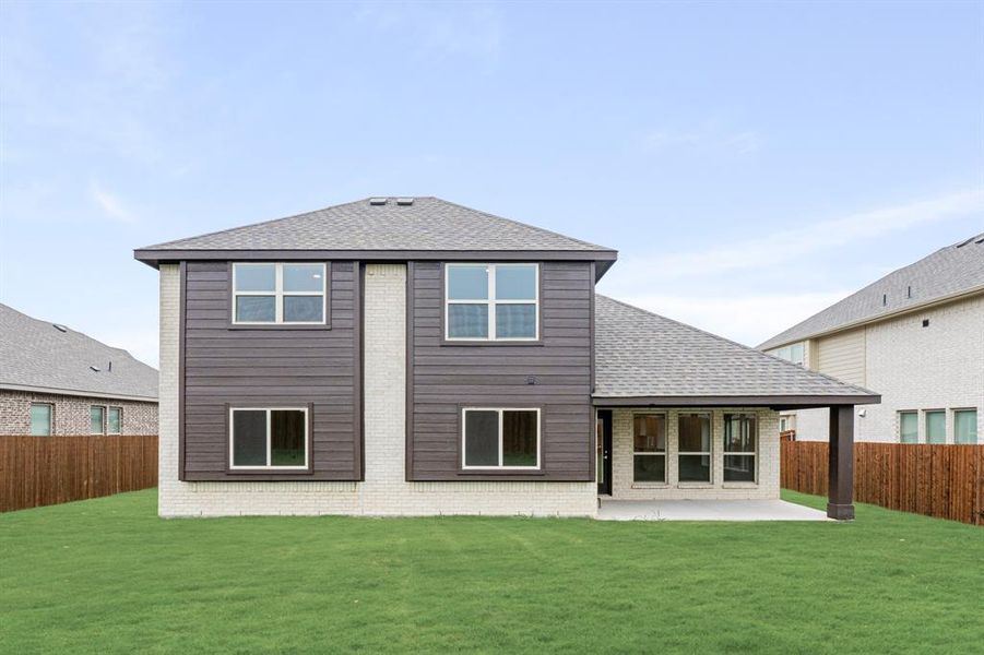 Front exterior of a new home in Hampton Park, Glenn Heights, TX, highlighting curb appeal (Image 1).