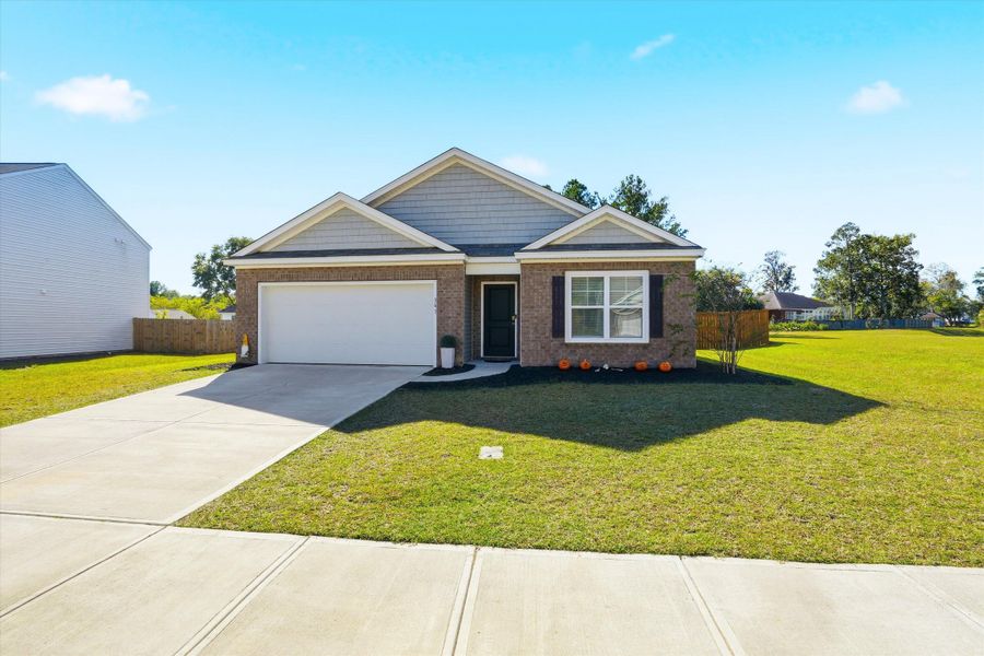 Front exterior of a new home in Stone Ridge, Moncks Corner, SC, highlighting curb appeal (Image 21).