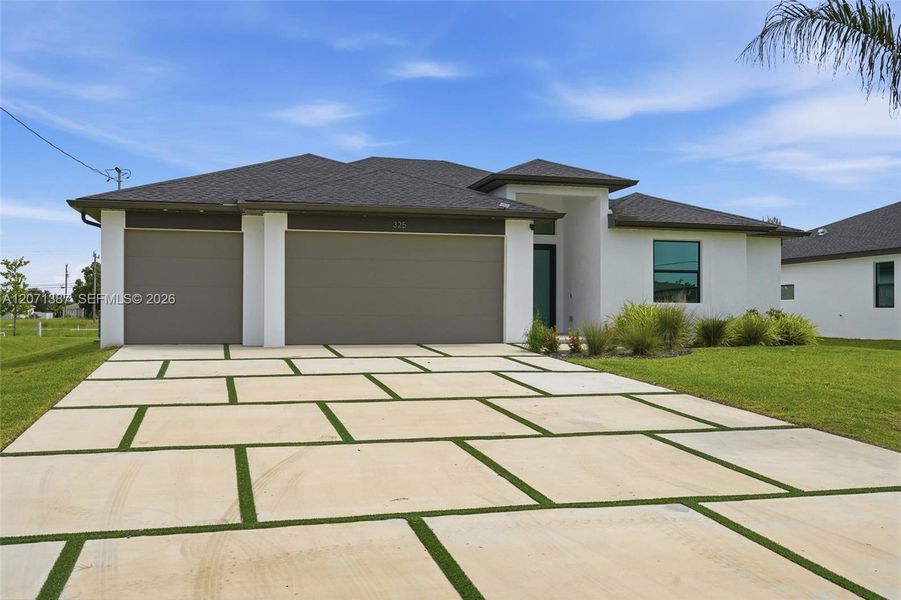 Front exterior of a new home in , Cape Coral, FL, highlighting curb appeal (Image 30).