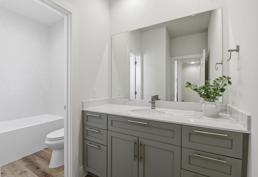 Full secondary bath with contemporary fixtures.