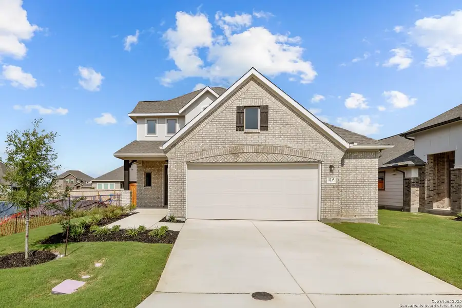 Front exterior of a new home in Megan's Landing, Castroville, TX, highlighting curb appeal (Image 9).