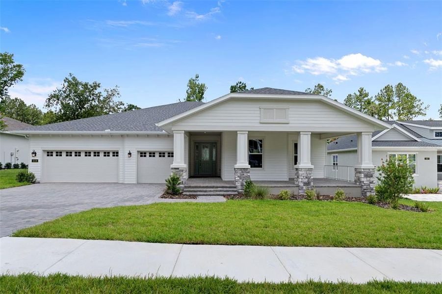 Front exterior of a new home in Southern Hills Plantation, Brooksville, FL, highlighting curb appeal (Image 24). Front exterior of a new home in Southern Hills Plantation, Brooksville, FL, highlighting curb appeal (Image 24).