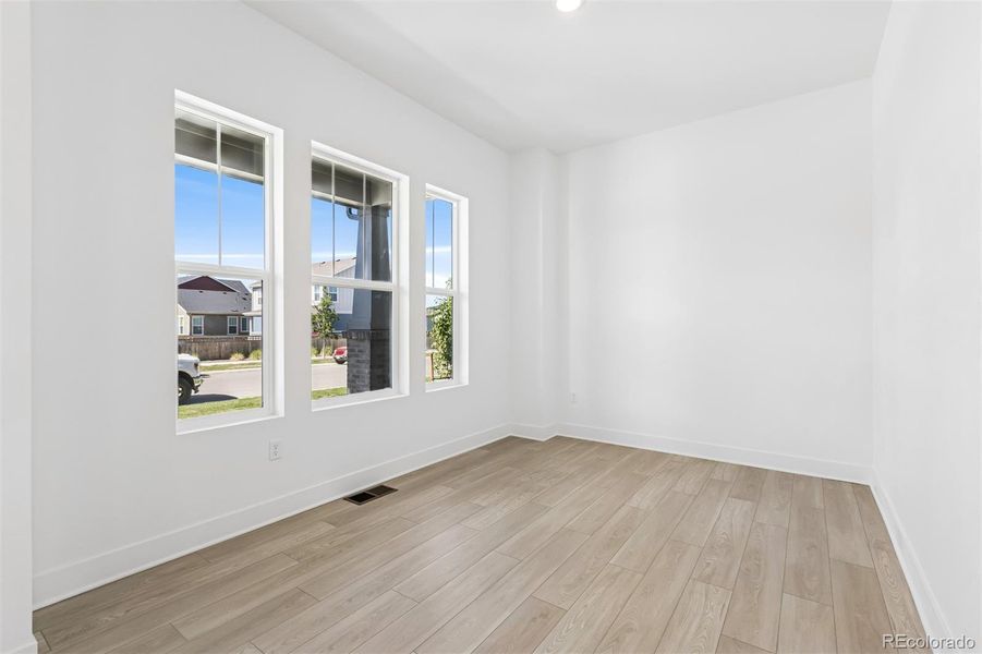 Spacious, unfurnished interior of a new home in Painted Prairie Cottage, Aurora (Image 28).