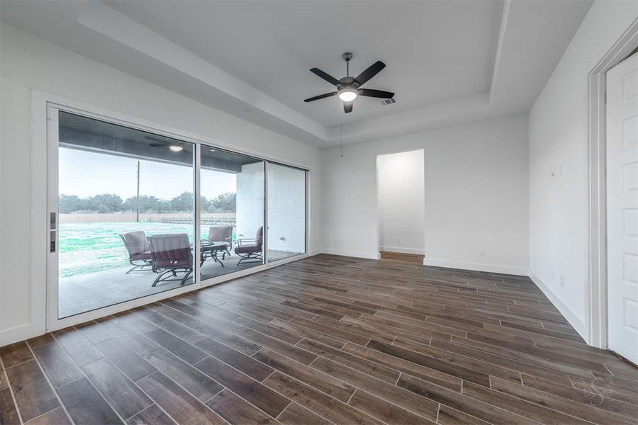 The Game Room also boasts glass sliders that, along with the informal dining area, open the space to the outdoors.  Perfect for entertaining. Not shown is a second staircase to second floor.