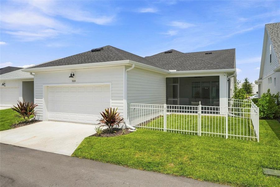 Front exterior of a new home in SeaFlower – Bungalow Homes, Bradenton, FL, highlighting curb appeal (Image 20).