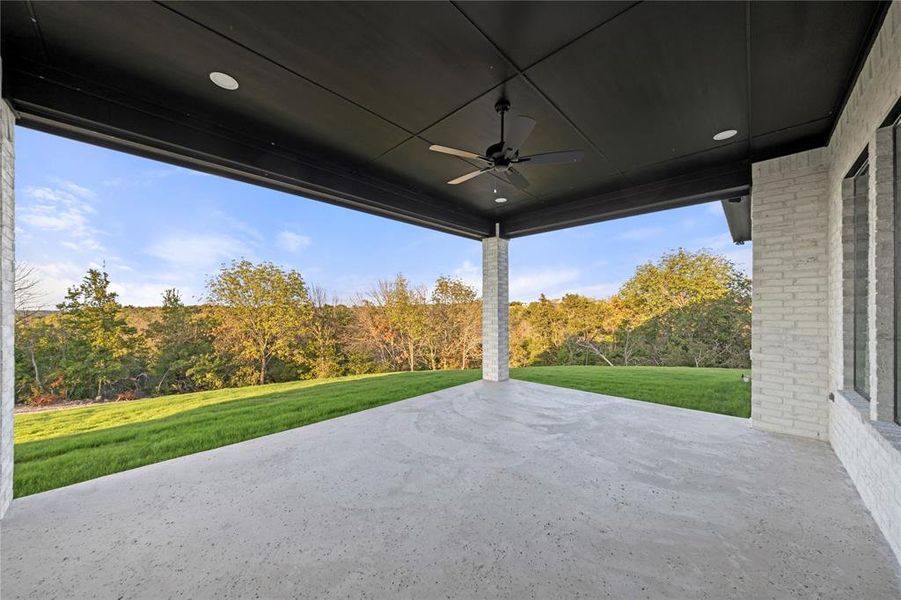 View of patio featuring a ceiling fan