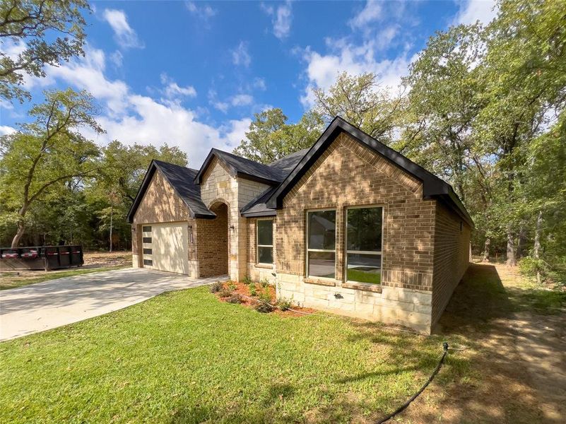 Front exterior of a new home in , Trinidad, TX, highlighting curb appeal (Image 11). Front exterior of a new home in , Trinidad, TX, highlighting curb appeal (Image 11).