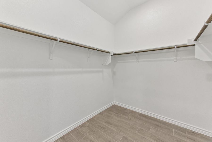 Spacious closet featuring wood tiled floors Spacious closet featuring wood tiled floors