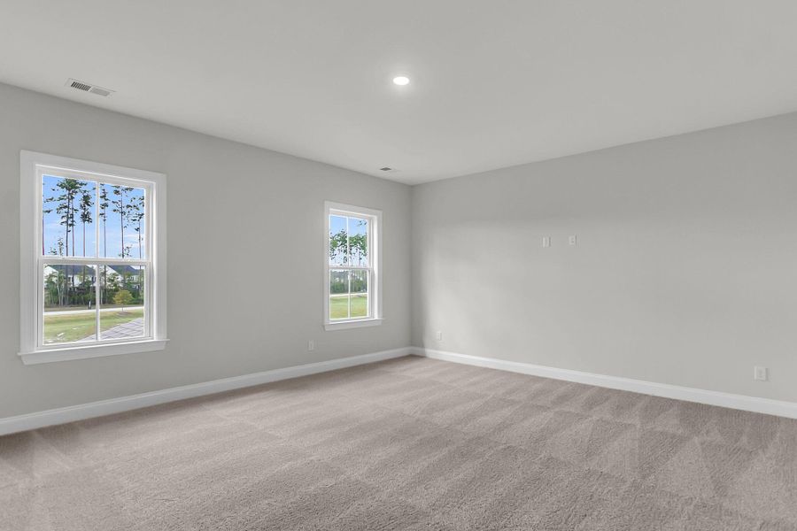 Spacious, unfurnished interior of a new home in Tidewater at Lakes of Cane Bay, Summerville (Image 23).