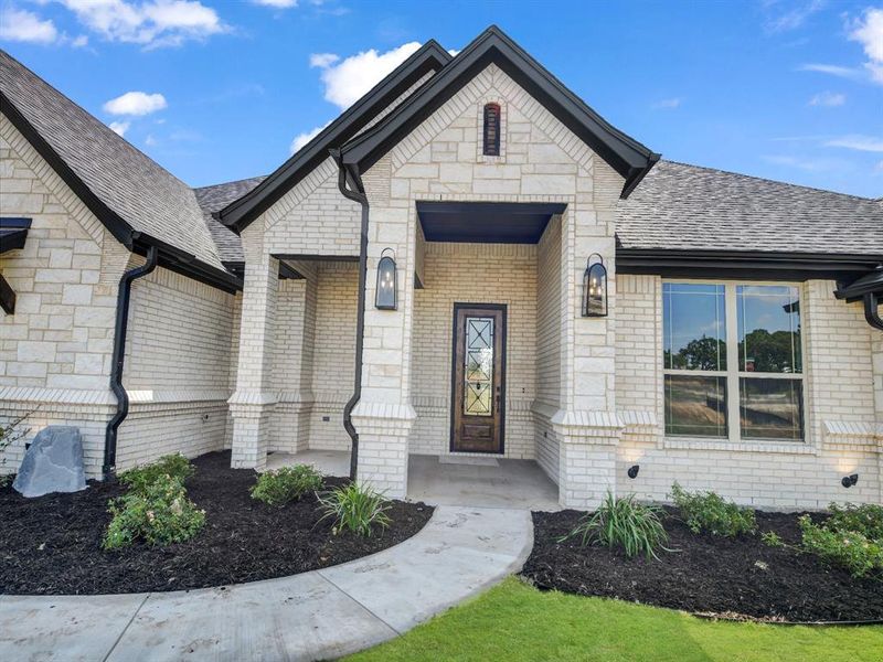 Front exterior of a new home in , Azle, TX, highlighting curb appeal (Image 23). Front exterior of a new home in , Azle, TX, highlighting curb appeal (Image 23).