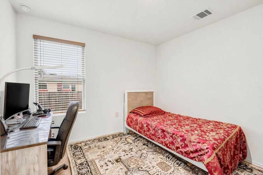 Furnished interior view inside a new home in Tarasco Gardens, San Antonio (Image 12).