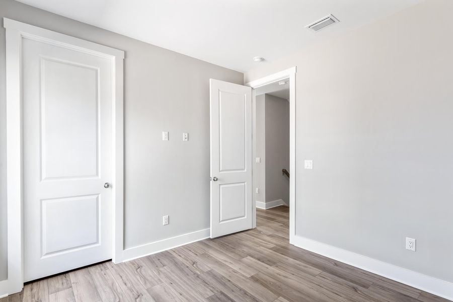 Representative unfurnished interior of a home built from the Pearl by Brock Built in Nautilus Pointe, Inlet Beach (Image 16).