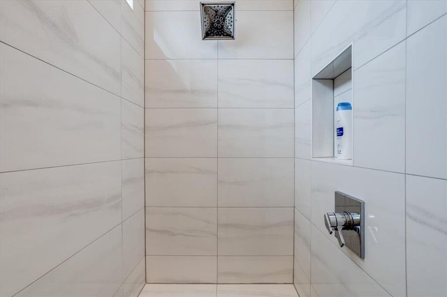 Full bath with a tile shower