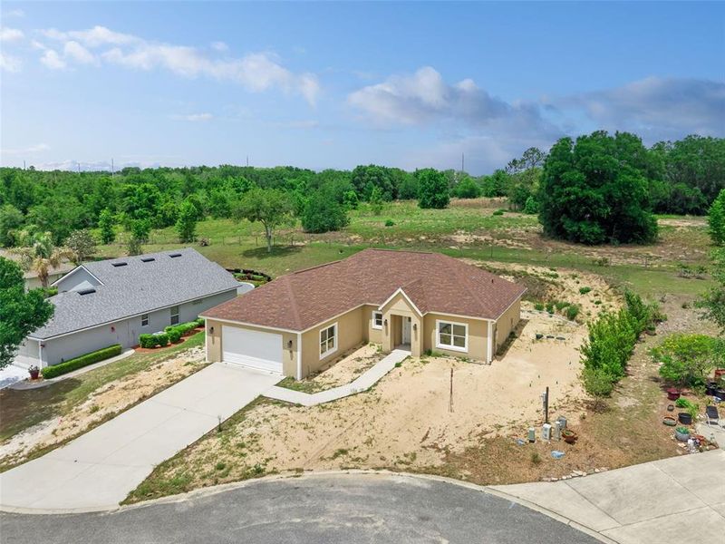 Front exterior of a new home in , Umatilla, FL, highlighting curb appeal (Image 6).
