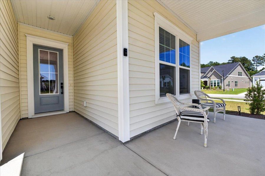 Exterior details and patio area of a home in Summerwind Crossing at Lakes of Cane Bay, Summerville (Image 27).