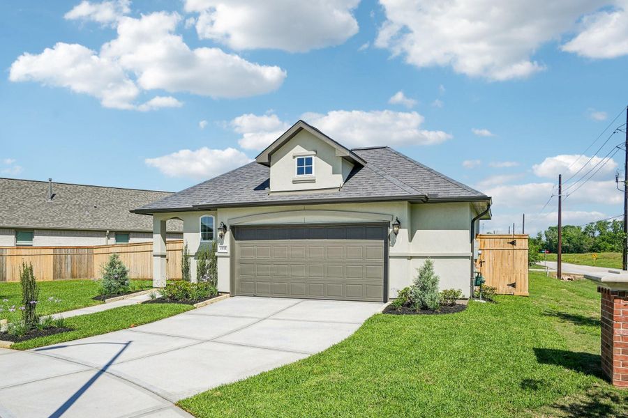 Front exterior of a new home in Sienna 40', Missouri City, TX, highlighting curb appeal (Image 2). Front exterior of a new home in Sienna 40', Missouri City, TX, highlighting curb appeal (Image 2).
