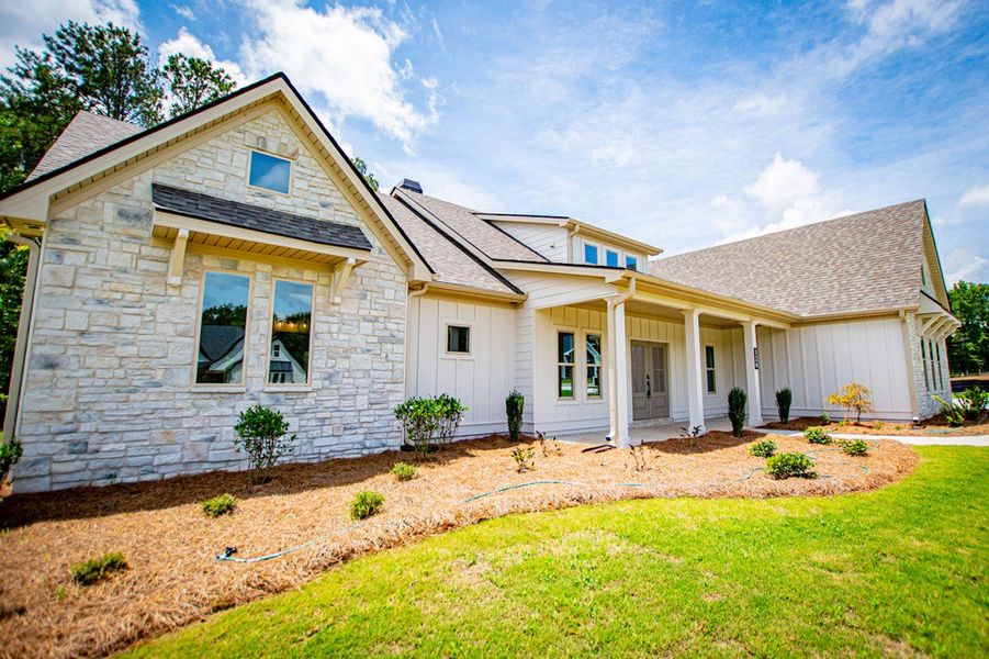 Exterior details and patio area of a home in WOODMONT RESERVE, Roopville (Image 37).