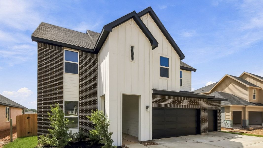 Front exterior of a new home in Silverthorne, Conroe, TX, highlighting curb appeal (Image 2). Front exterior of a new home in Silverthorne, Conroe, TX, highlighting curb appeal (Image 2).