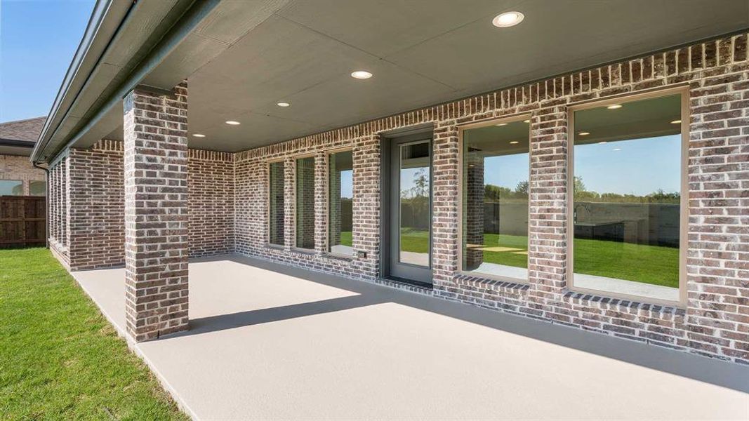 Exterior details and patio area of a home in Trinity Falls 60', McKinney (Image 2). Exterior details and patio area of a home in Trinity Falls 60', McKinney (Image 2).