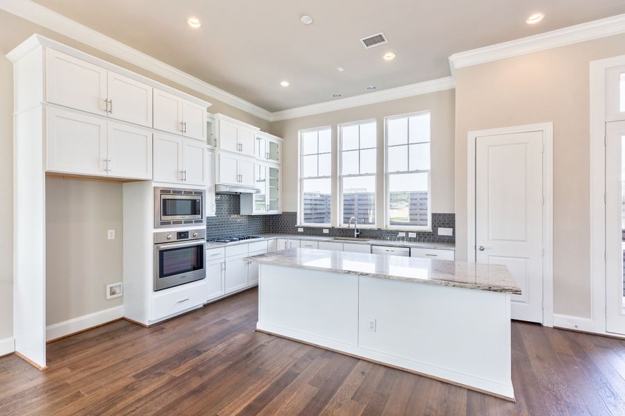 Furnished interior view inside a new home in Concourse at Mueller, Austin (Image 5). Furnished interior view inside a new home in Concourse at Mueller, Austin (Image 5).