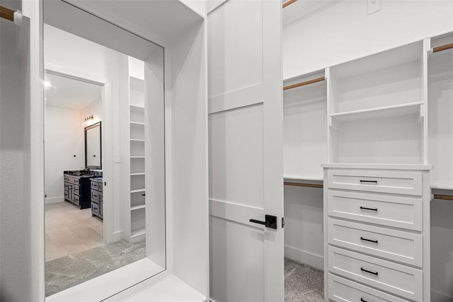 Walk in closet featuring light tile patterned flooring